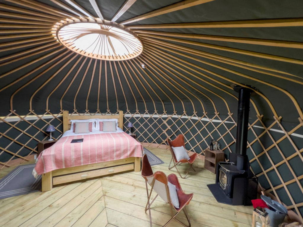 An exterior shot of the Foxglove Yurt at Raynham Estate Glamping