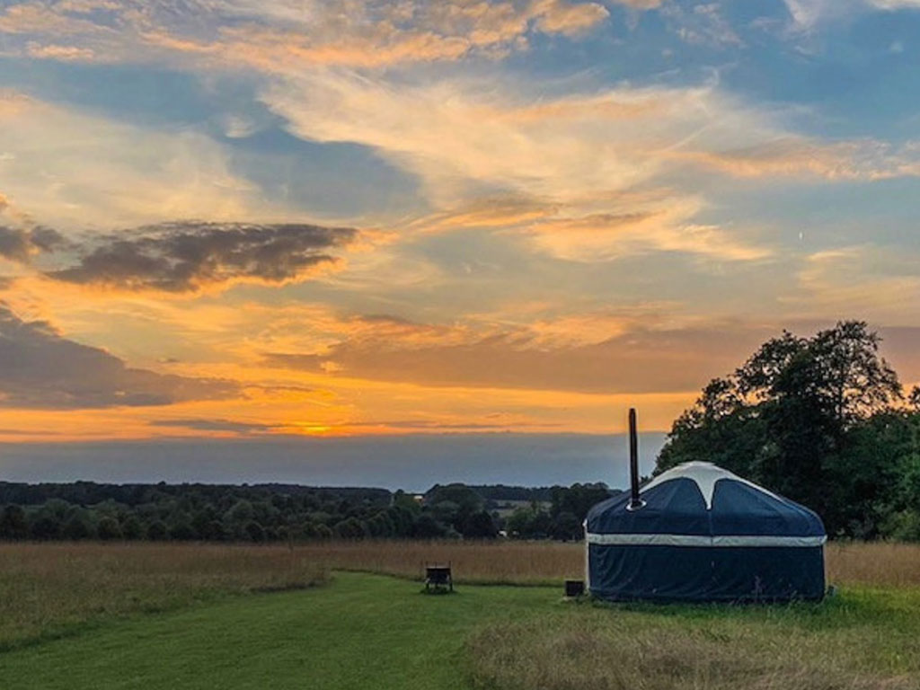 An exterior shot of the Clover Yurt at Raynham Estate Glamping